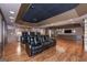Luxurious home theater with leather recliners, a projector, and a bar area, providing the ultimate entertainment experience at 297 Collegiate Dr, Powder Springs, GA 30127