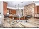 Gourmet kitchen boasting granite countertops, stainless steel appliances, and a stone range hood at 297 Collegiate Dr, Powder Springs, GA 30127