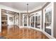 Open living room with fireplace, abundant natural light, and hardwood flooring at 297 Collegiate Dr, Powder Springs, GA 30127