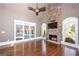 Bright living room with fireplace and large windows overlooking the pool at 297 Collegiate Dr, Powder Springs, GA 30127