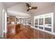 Open floor plan with views of the pool, hardwood floors, kitchen, and access to the outdoors at 297 Collegiate Dr, Powder Springs, GA 30127