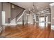 Spacious living area with hardwood floors, stone fireplace, and large windows at 297 Collegiate Dr, Powder Springs, GA 30127
