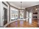 Bright living room with fireplace and large windows overlooking the pool at 297 Collegiate Dr, Powder Springs, GA 30127
