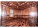 This home office features rich wood paneling, coffered ceilings and hardwood floors, creating a warm and professional space at 297 Collegiate Dr, Powder Springs, GA 30127
