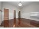 Bright room with wood floors, wainscoting, desk nook, and access to bathroom and closet at 297 Collegiate Dr, Powder Springs, GA 30127