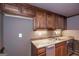Stylish wet bar with stainless steel appliances, granite countertops, and wood cabinets, ready for entertaining at 297 Collegiate Dr, Powder Springs, GA 30127