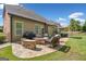 A spacious backyard with a stone patio and outdoor seating area at 3015 Arbor Song Ct, Cumming, GA 30041
