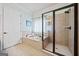 Bright bathroom showcases a soaking tub, tiled shower, and stylish fixtures at 3015 Arbor Song Ct, Cumming, GA 30041