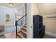 Bright foyer with hardwood floors, staircase, and a view of the living room, offering a warm welcome at 3015 Arbor Song Ct, Cumming, GA 30041