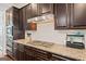 Gourmet kitchen featuring stainless appliances, granite countertops, and ample cabinet space at 3015 Arbor Song Ct, Cumming, GA 30041