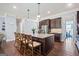 Spacious kitchen featuring a large island with seating, granite counters and stainless steel appliances at 3015 Arbor Song Ct, Cumming, GA 30041