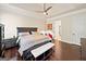 Comfortable main bedroom features tray ceilings, ceiling fan and private bathroom entrance at 3015 Arbor Song Ct, Cumming, GA 30041
