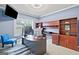 This office features custom wood cabinets, shelving, and a large window for natural light at 3015 Arbor Song Ct, Cumming, GA 30041