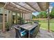 Backyard patio with pergola and a dining table for outdoor gatherings with friends and Gathering at 3015 Arbor Song Ct, Cumming, GA 30041