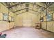 Spacious garage, featuring concrete floors and spray foam insulation on the walls and ceiling at 2067 Skyhawk Ln, Acworth, GA 30102