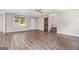 Spacious living room with wood floors, a ceiling fan, and natural light at 2067 Skyhawk Ln, Acworth, GA 30102