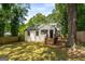 Charming brick home with fenced backyard, mature shade trees and inviting porch at 345 Adelle Se St, Atlanta, GA 30315