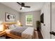Cozy bedroom featuring a ceiling fan, bright window, stylish décor, and warm, neutral tones at 345 Adelle Se St, Atlanta, GA 30315