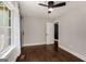 Bedroom featuring hardwood floors and access to ensuite through white sliding barn door at 345 Adelle Se St, Atlanta, GA 30315