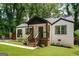 Quaint bungalow showcasing fresh landscaping, stylish brick work, and a welcoming front entrance at 345 Adelle Se St, Atlanta, GA 30315