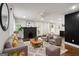 Sunlit living room boasts fireplace, modern finishes, and hardwood floors, creating a cozy yet stylish atmosphere at 345 Adelle Se St, Atlanta, GA 30315