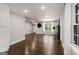 Expansive living area with hardwood floors, bright lighting, and an open layout, ideal for versatile living at 345 Adelle Se St, Atlanta, GA 30315
