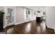 Bright and airy living room showcasing hardwood floors and easy access to the adjacent kitchen area at 345 Adelle Se St, Atlanta, GA 30315