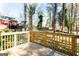 View from the deck showing wooden railings and the backyard with large trees at 870 Gaston Sw St, Atlanta, GA 30310
