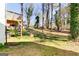 An expansive backyard features towering trees, manicured lawn, and deck at 870 Gaston Sw St, Atlanta, GA 30310