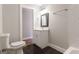 Updated bathroom with a black tiled floor, toilet, and shower at 870 Gaston Sw St, Atlanta, GA 30310