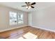 A bright bedroom with hardwood floors, fan and windows at 870 Gaston Sw St, Atlanta, GA 30310
