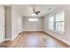Spacious bedroom with hardwood floors, neutral paint, and natural light from two windows at 870 Gaston Sw St, Atlanta, GA 30310