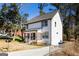 Side view of the house with a well manicured lawn, driveway, and front porch at 870 Gaston Sw St, Atlanta, GA 30310