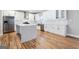 Well-appointed kitchen with a large island, stainless appliances, and ample cabinet space at 870 Gaston Sw St, Atlanta, GA 30310