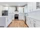 Modern kitchen features an island, stainless steel appliances, and white subway tile at 870 Gaston Sw St, Atlanta, GA 30310