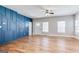 Spacious living room with hardwood floors, lots of natural light, and a blue accent wall at 870 Gaston Sw St, Atlanta, GA 30310