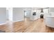 Open living area with a staircase, a bright window, and hardwood floors at 870 Gaston Sw St, Atlanta, GA 30310