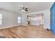 Open-concept living room with hardwood floors and a modern kitchen in the background at 870 Gaston Sw St, Atlanta, GA 30310