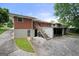 The backyard features a brick exterior with a staircase and large parking spaces at 135 5Th Ave, Jonesboro, GA 30236