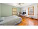 Comfortable bedroom featuring hardwood floors and natural light at 135 5Th Ave, Jonesboro, GA 30236