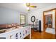Bright bedroom with hardwood floors and a minimalist aesthetic at 135 5Th Ave, Jonesboro, GA 30236