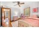 Cozy bedroom with pink accents, a comfortable bed, and ample natural light at 135 5Th Ave, Jonesboro, GA 30236