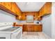 Traditional kitchen with wooden cabinets and classic appliances at 135 5Th Ave, Jonesboro, GA 30236