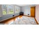 Bright living room features large windows, hardwood floors, and neutral paint scheme, perfect for relaxing and entertaining at 135 5Th Ave, Jonesboro, GA 30236