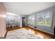 Inviting living room with hardwood floors, large windows, and an adjacent dining area at 135 5Th Ave, Jonesboro, GA 30236