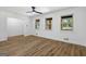 Bright living room featuring wood-look floors, white walls, and large windows that let in natural light at 1400 North Avenue Nw, Atlanta, GA 30318
