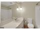 Well-lit bathroom with a large mirror, ample counter space, and classic fixtures at 3180 S Elizabeth Dr, Douglasville, GA 30135