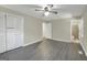 Bedroom with closet, ceiling fan, and updated flooring provides a comfortable living space at 3180 S Elizabeth Dr, Douglasville, GA 30135