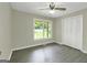 Bright bedroom with neutral walls, large window, closet, and new flooring at 3180 S Elizabeth Dr, Douglasville, GA 30135