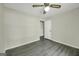 Simple bedroom with a ceiling fan, neutral walls, and new stylish flooring at 3180 S Elizabeth Dr, Douglasville, GA 30135